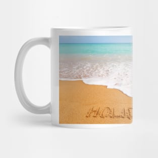 Inscription "HOLIDAY" made on beautiful beach by the blue sea Mug